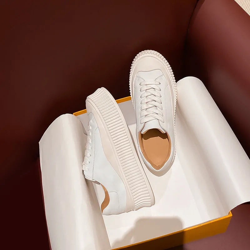 Women's suede platform sneakers with thick rubber soles and cross binding detail in black, white and white-black colour options