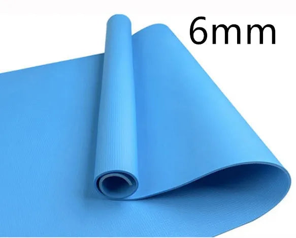 Red EVA fitness yoga mat showing texture and thickness, rolled partially with carry bag.