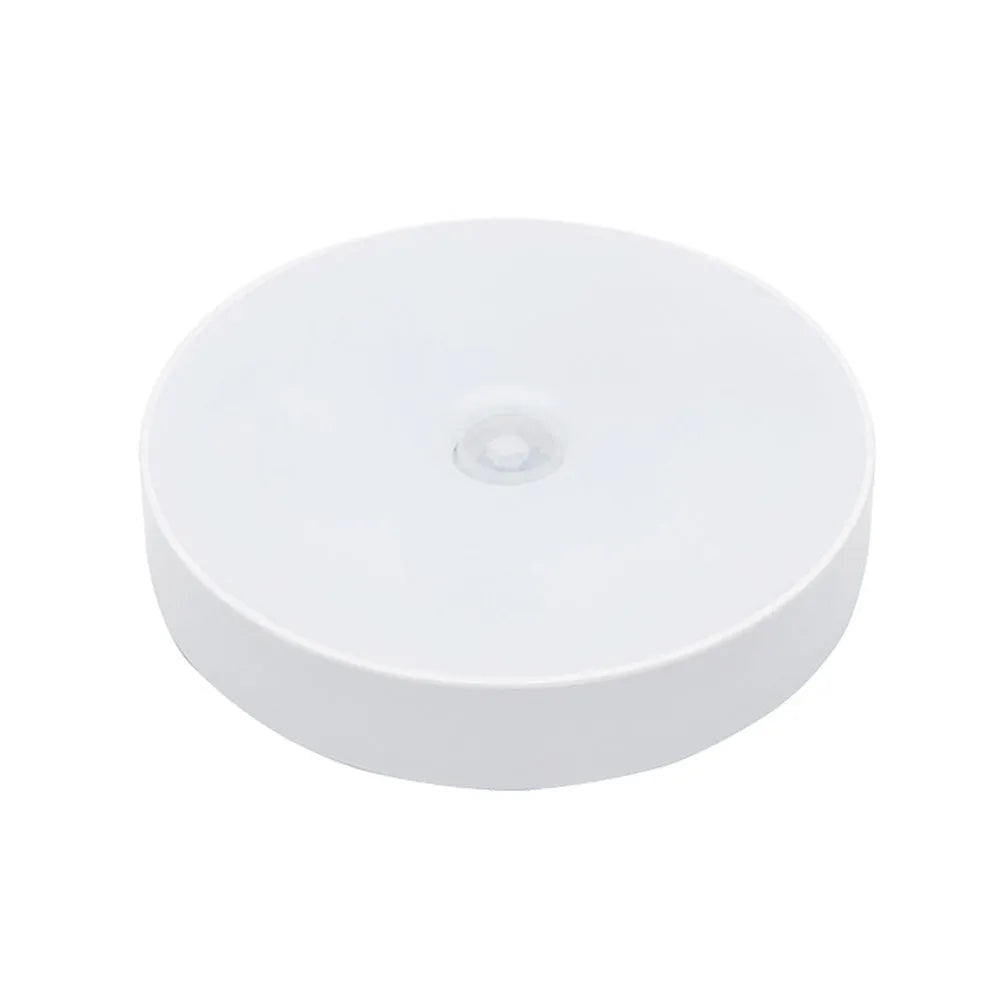 USB rechargeable motion sensor LED night light in beige or white with 86mm diameter compact design