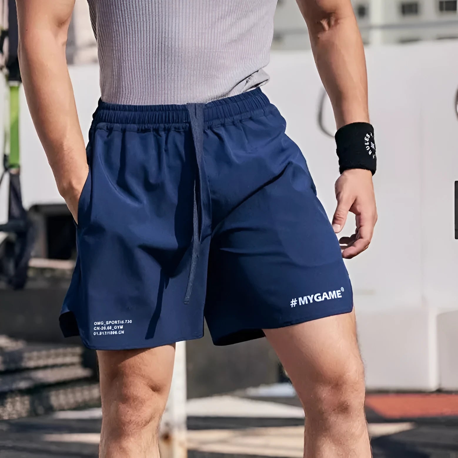 Men's grey fitness shorts showing short-length design with elastic waistband for training and athletic wear