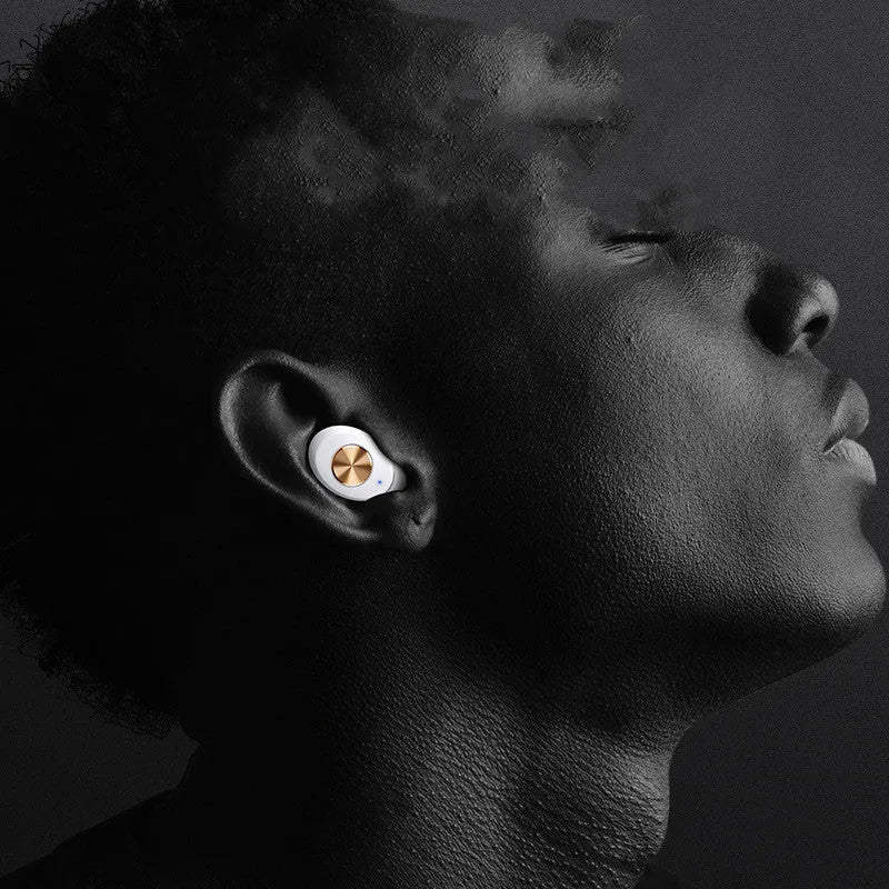 Wireless Bluetooth mini TWS earbuds and charging case in black, shown for scale.
