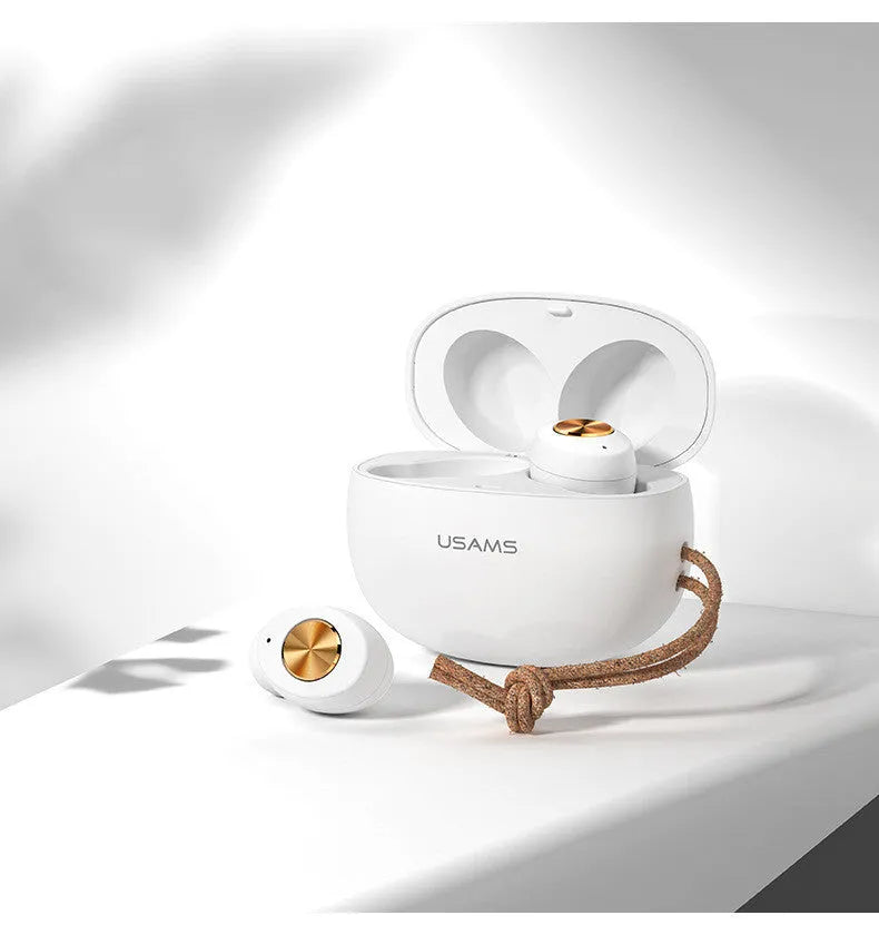 Wireless Bluetooth mini TWS earbuds and charging case in black, shown for scale.