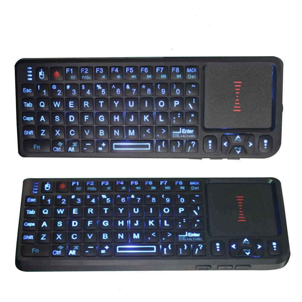 Black wireless mini keyboard with touch screen and matching optical mouse on a desk