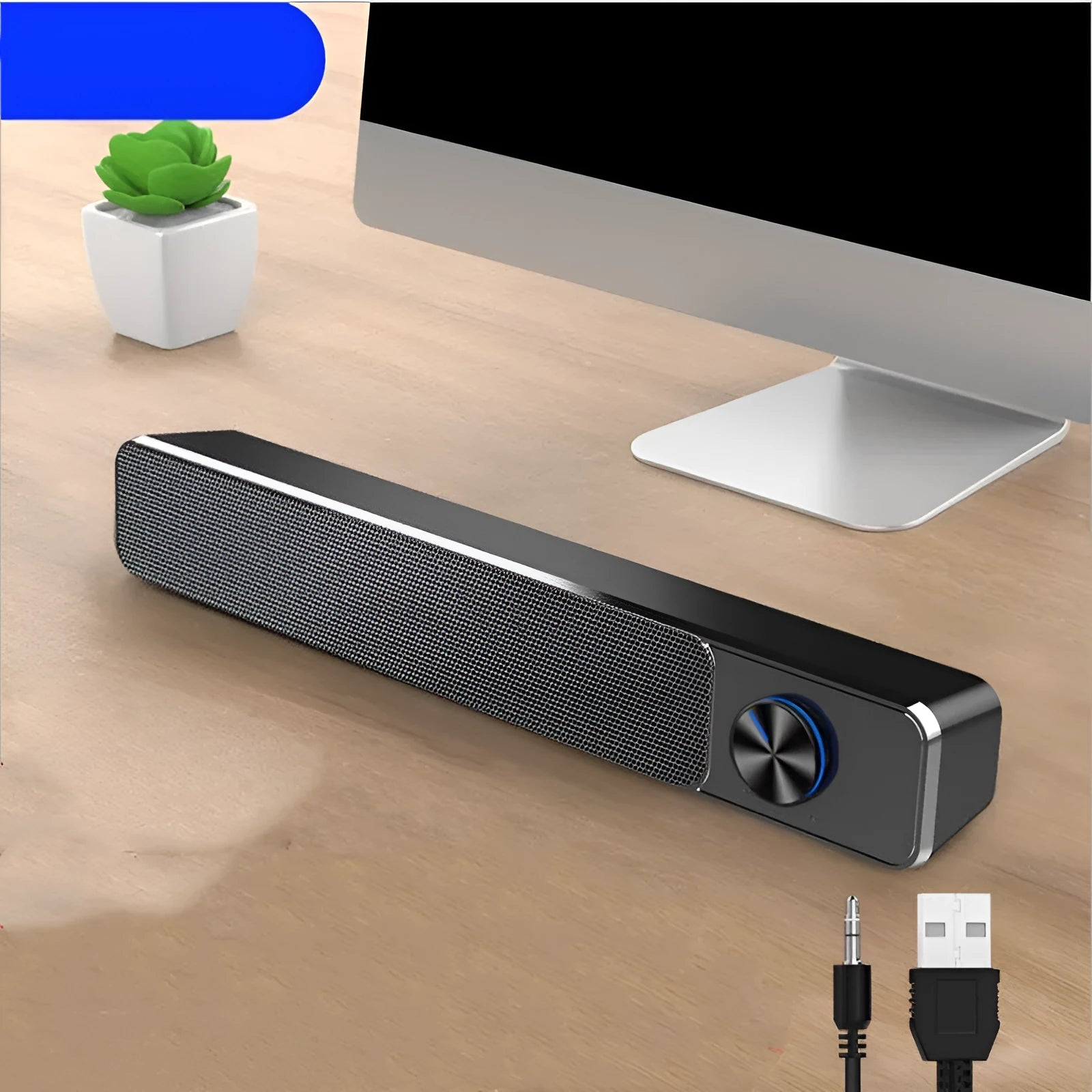 Black and white wired desktop computer speakers with ABS PC casing on a desk