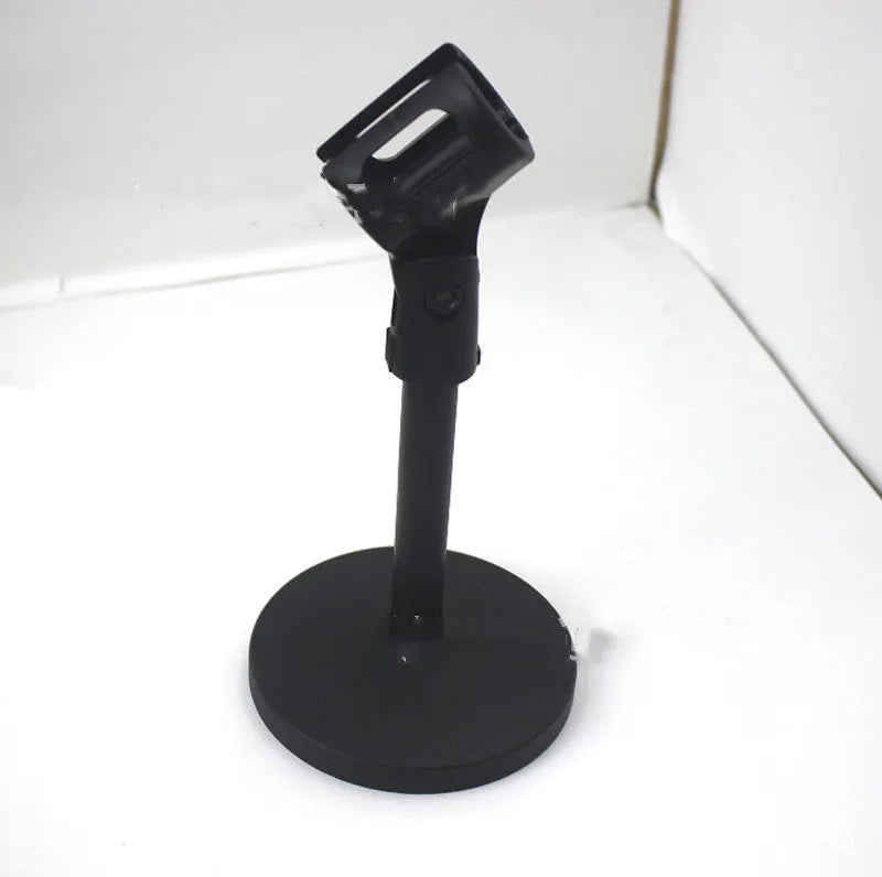 Black desktop microphone bracket with metal chassis and plastic clip for studio recording
