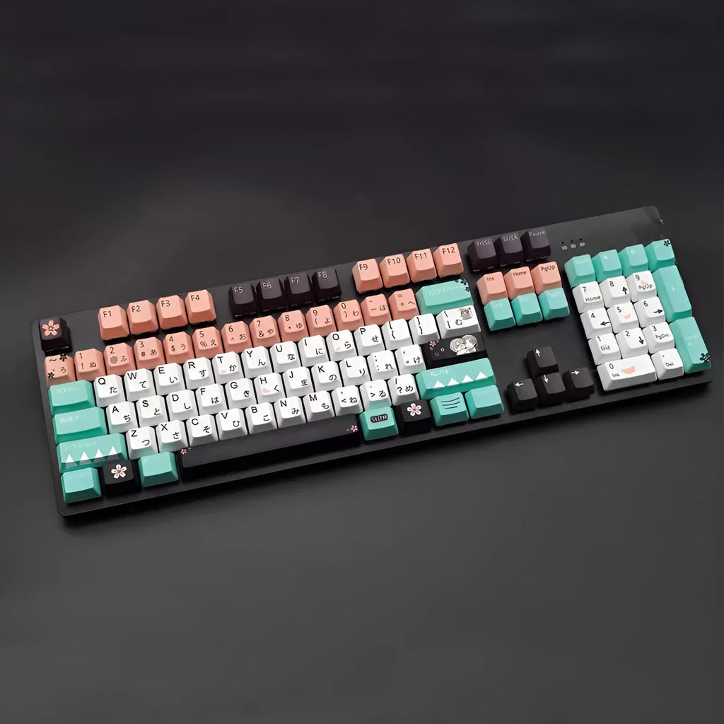 Green mechanical keyboard keycaps with animated character designs showing Cherry MX stems and wireless USB dongle