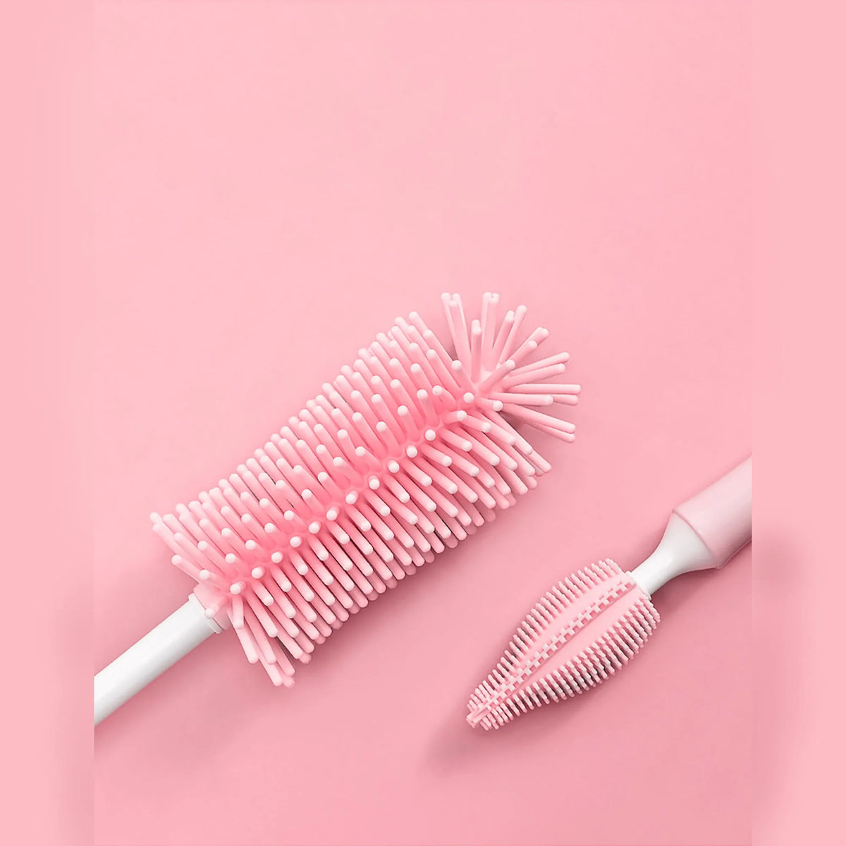Silicone baby bottle cleaning brush set in pink, blue, and yellow colours for washing bottles and scrubbing straws.