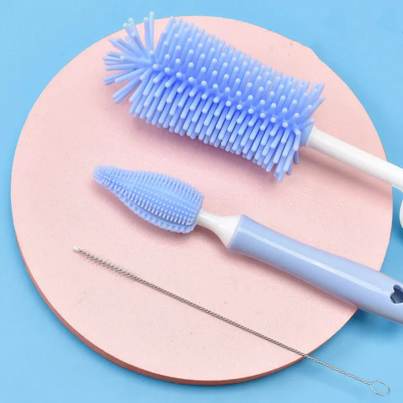 Silicone baby bottle cleaning brush set in pink, blue, and yellow colours for washing bottles and scrubbing straws.