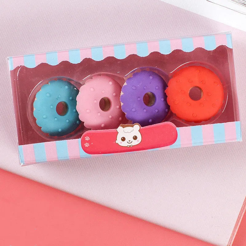 Set of 12 cartoon food erasers including cones, ice cream, donuts, and lollipops for children.