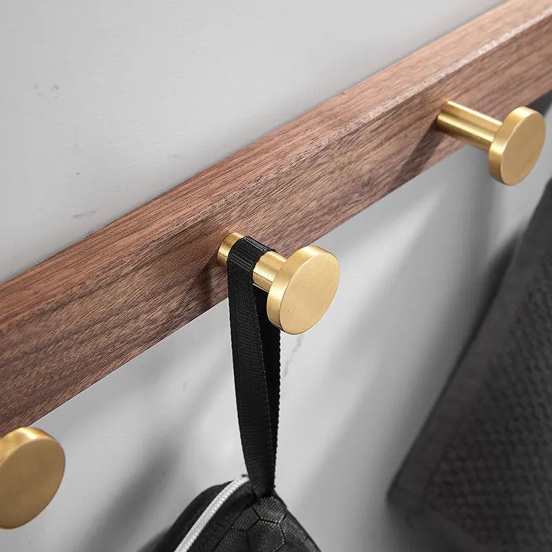 Black walnut bathroom wall hooks with brass aluminium hooks in perforated row design