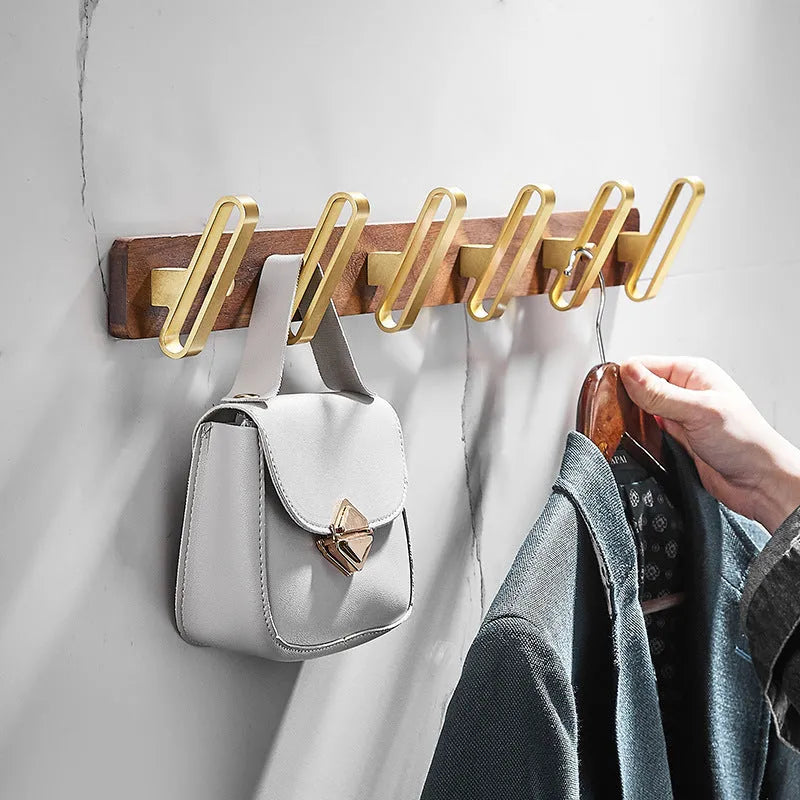 Black walnut bathroom wall hooks with brass aluminium hooks in perforated row design