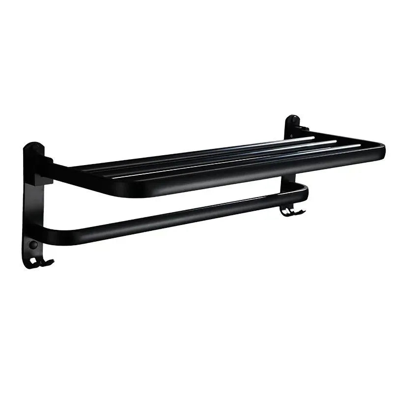 Aluminium two-tier bathroom folding shelf on a white wall, showing optional hooks and perforated surface design.