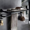 Aluminium two-tier bathroom folding shelf on a white wall, showing optional hooks and perforated surface design.