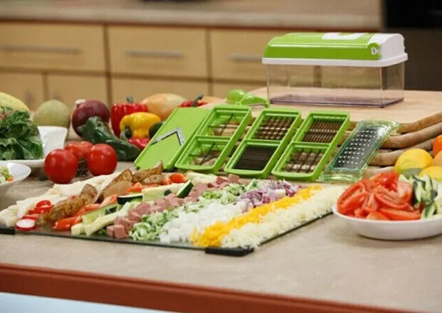 Green manual food chopper set with stainless steel blades, showing 12 pieces including handle and accessories.