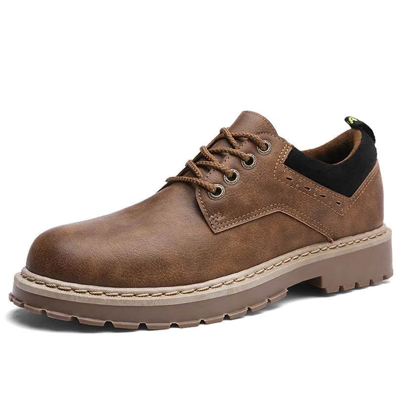 Men's black casual shoes with round toe and front laces on a rubber sole.