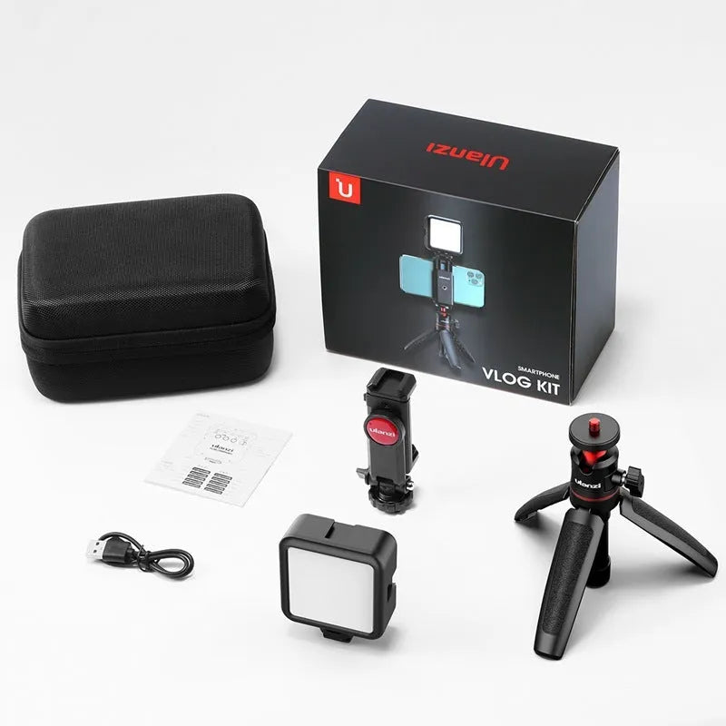 Folded mobile phone vlog bracket with built-in fill light next to a smartphone