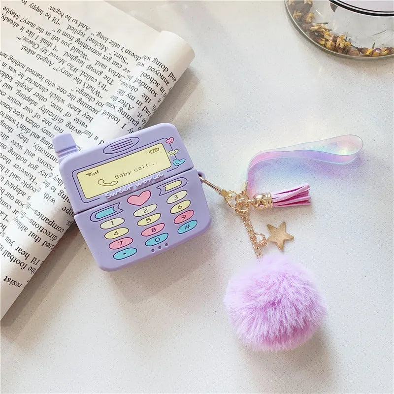Purple silicone clamshell case for Apple-compatible wireless earphones with fur ball pendant