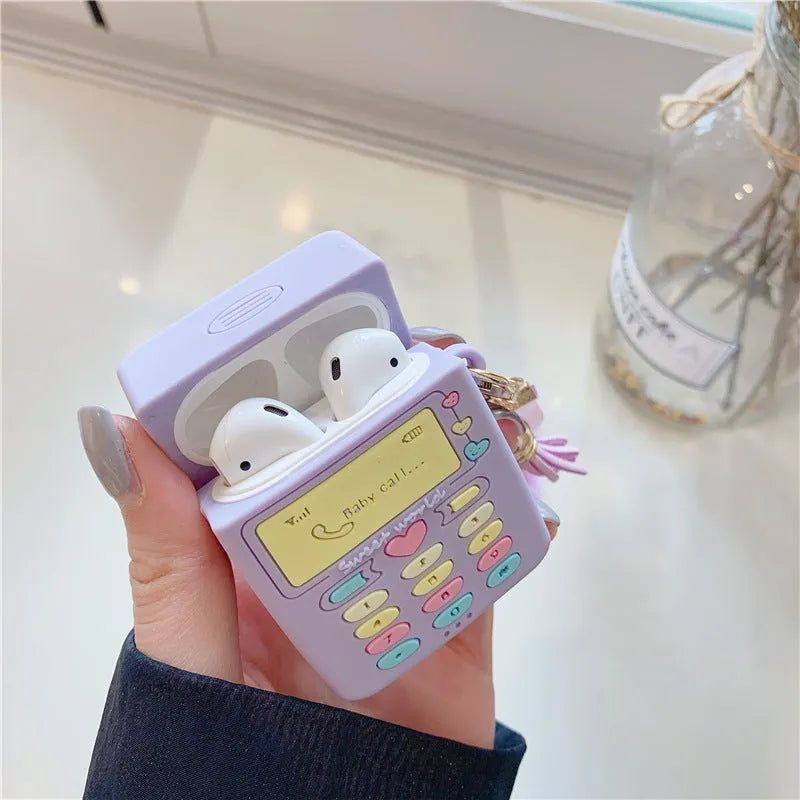 Purple silicone clamshell case for Apple-compatible wireless earphones with fur ball pendant