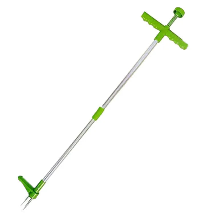 Creative manual weeding tool with aluminium handle and plastic head on garden soil.