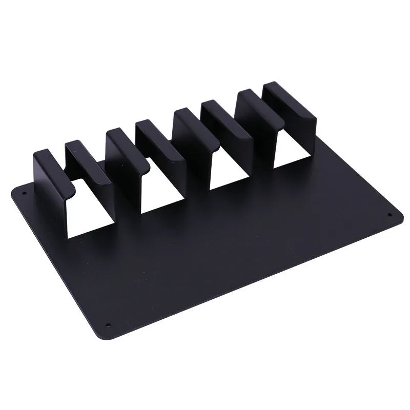 Black plastic wall-mounted frame holding four hair clippers