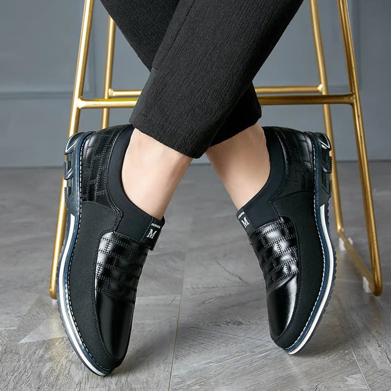 Men's large size blue casual leather shoes with low-cut design on a white background.