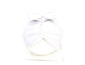 Baby girl wearing a soft pink knitted turban-style cap for ages 0-28 months.