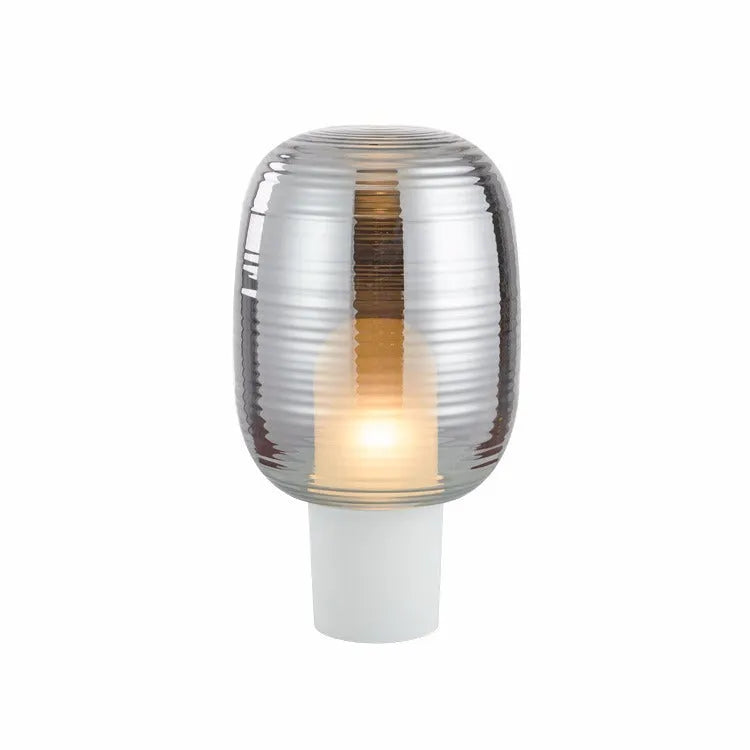Simple modern Nordic style glass table lamp in cognac colour with a push-button switch.