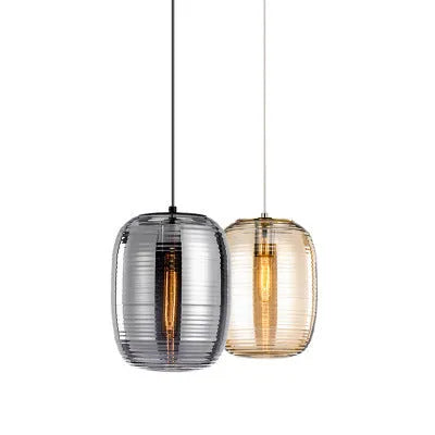 Simple modern Nordic style glass table lamp in cognac colour with a push-button switch.