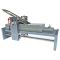 Aluminium alloy gantry fixed angle sharpening tool for woodworking chisels and planers on a workbench.