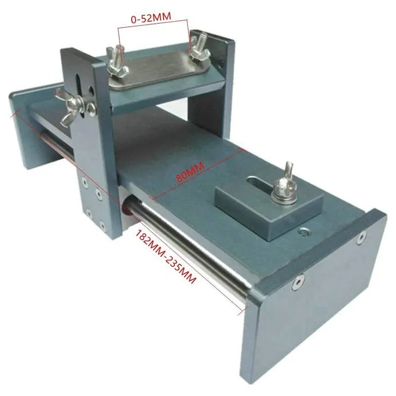Aluminium alloy gantry fixed angle sharpening tool for woodworking chisels and planers on a workbench.