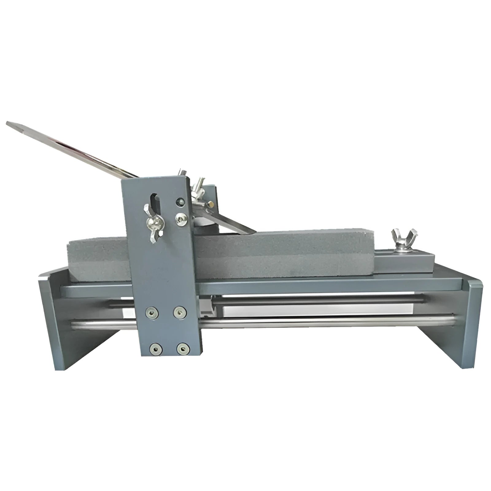 Aluminium alloy gantry fixed angle sharpening tool for woodworking chisels and planers on a workbench.