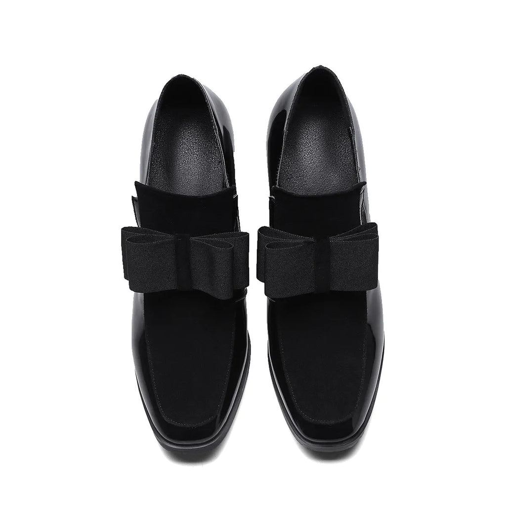 Black patent leather women's high heels with a thick square heel and square toe on a rubber sole.