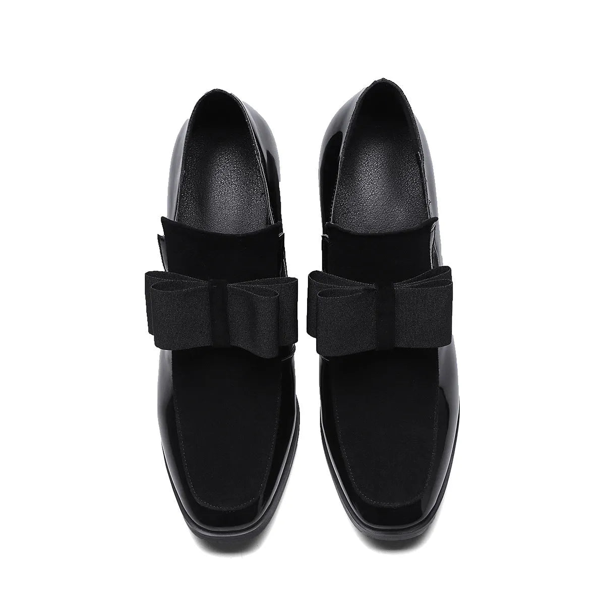 Black patent leather women's high heels with a thick square heel and square toe on a rubber sole.