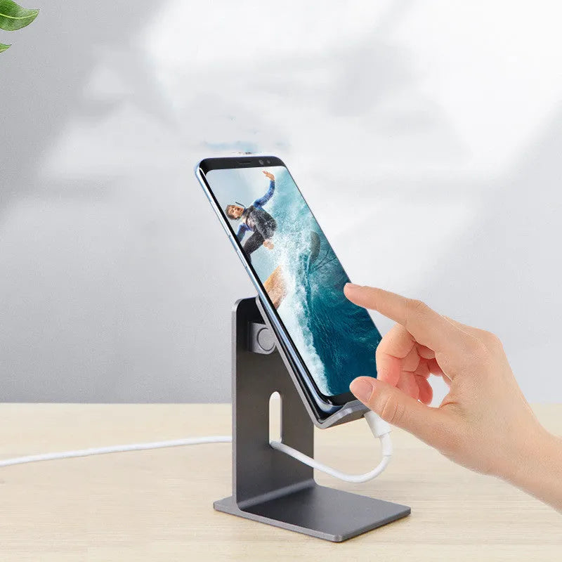 Alloy desktop mobile phone holder bracket in dark space grey colour on wooden desk