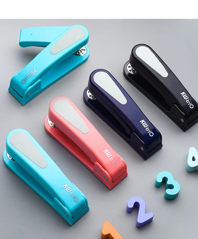 Rotatable student stapler with 360-degree spinning head in dark blue, showing staples loaded and metal outlet.