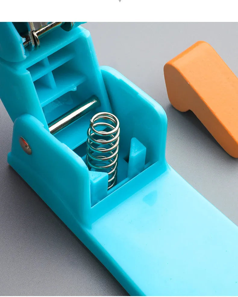 Rotatable student stapler with 360-degree spinning head in dark blue, showing staples loaded and metal outlet.