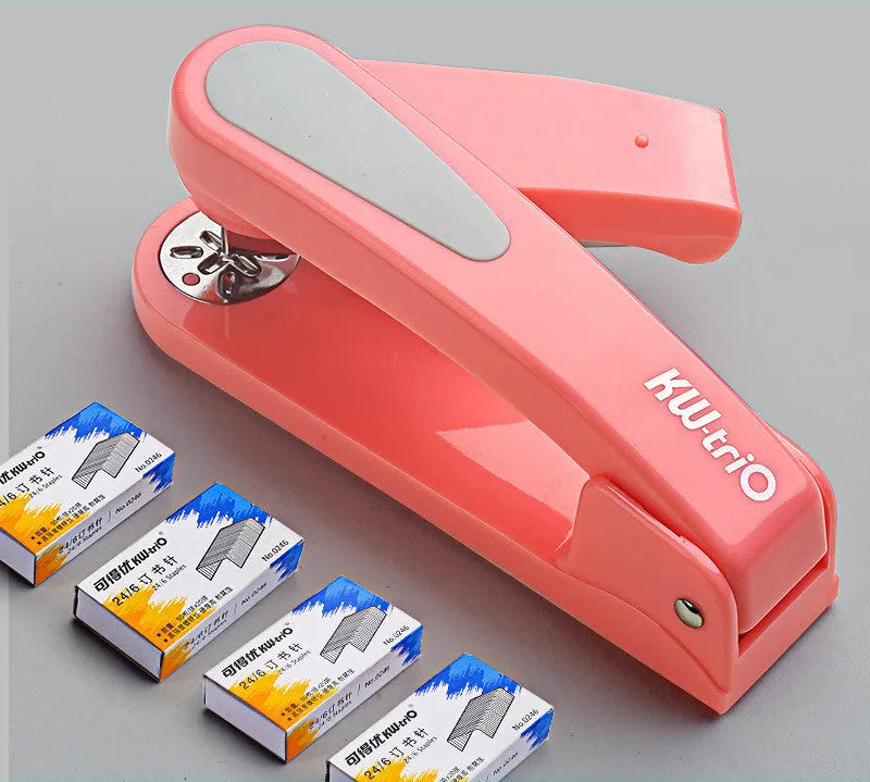 Rotatable student stapler with 360-degree spinning head in dark blue, showing staples loaded and metal outlet.