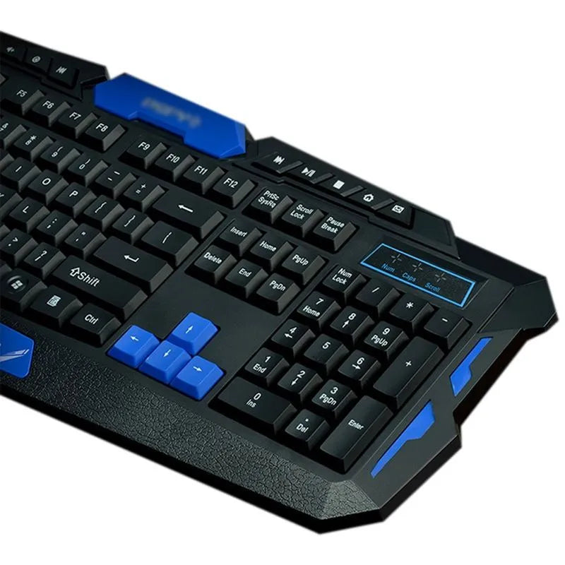Black and blue wireless keyboard and mouse set with USB receiver on a desk.
