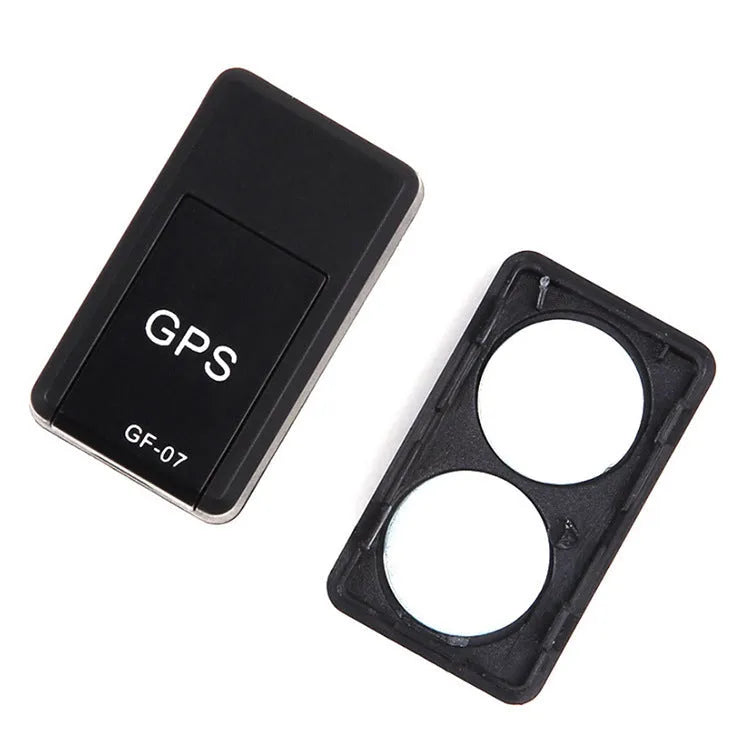 Small black magnetic GPS tracker device for cars with a USB charging cable.
