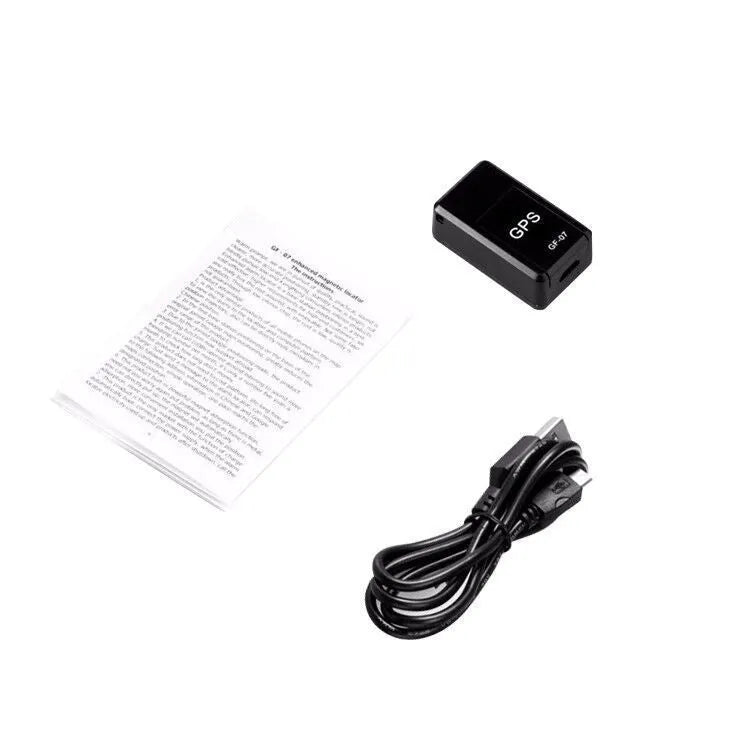 Small black magnetic GPS tracker device for cars with a USB charging cable.