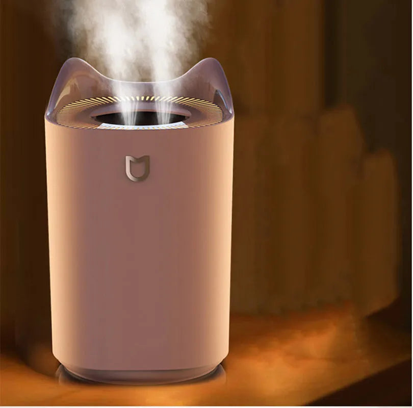 Double spray humidifier with large water tank in coral pink colour, showing three mist outlets