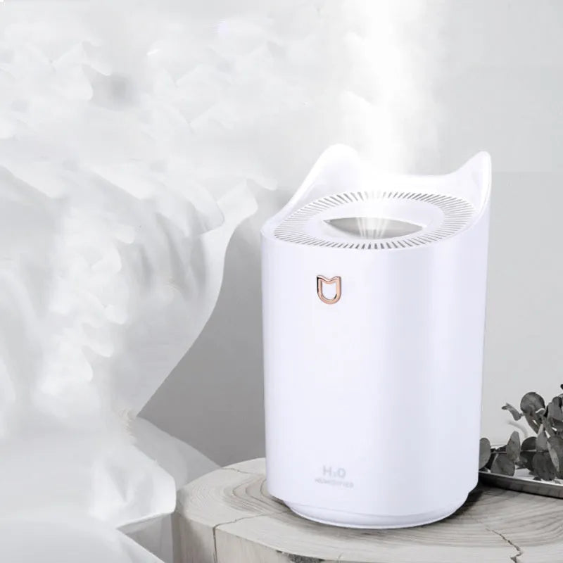 Double spray humidifier with large water tank in coral pink colour, showing three mist outlets