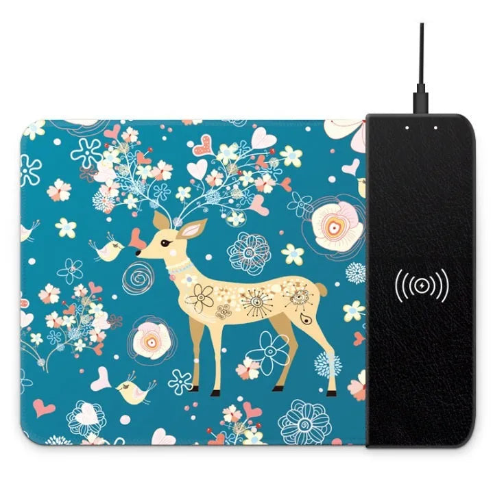 Wireless charging mouse pad with RGB edge lighting and cartoon graphic on black cloth surface.