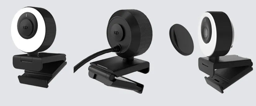 Black USB webcam with magnetic privacy cover on a laptop screen