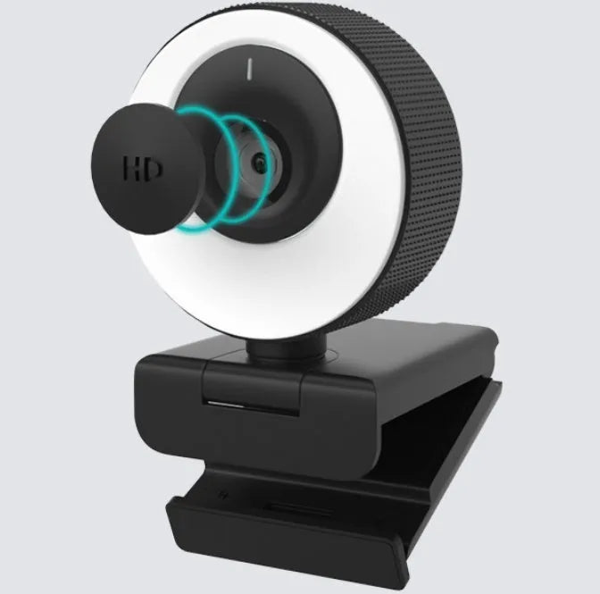 Black USB webcam with magnetic privacy cover on a laptop screen