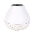 White round Bluetooth humidifier and essential oil aroma diffuser with night light.