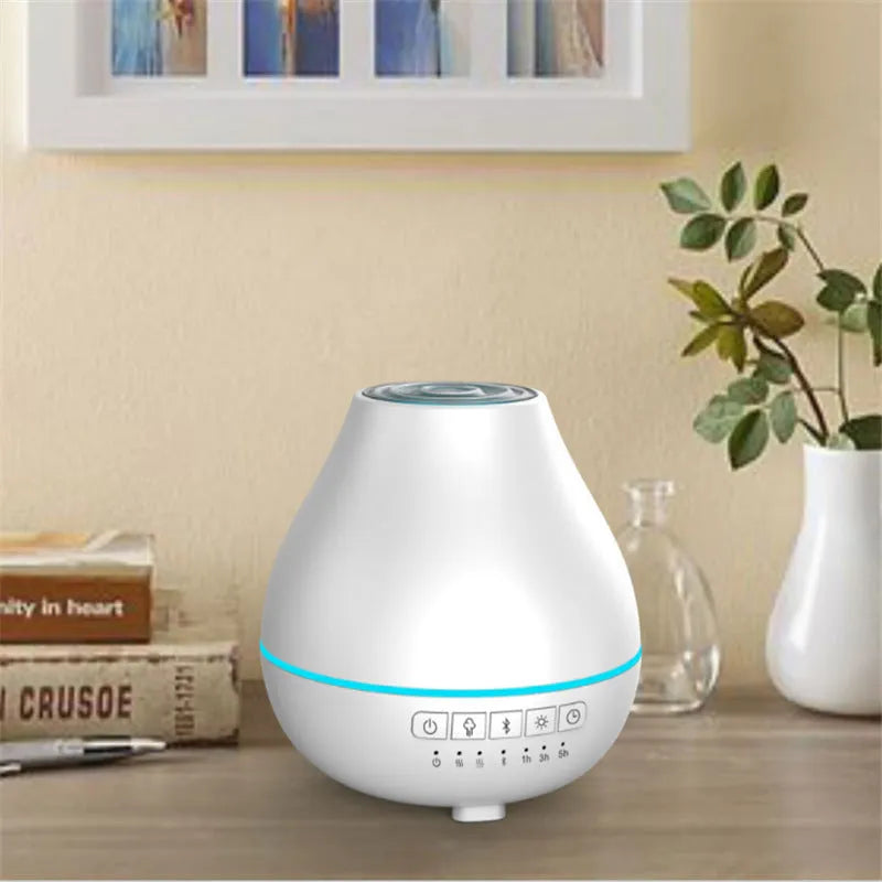 White round Bluetooth humidifier and essential oil aroma diffuser with night light.