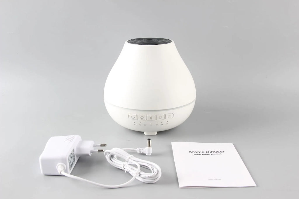 White round Bluetooth humidifier and essential oil aroma diffuser with night light.