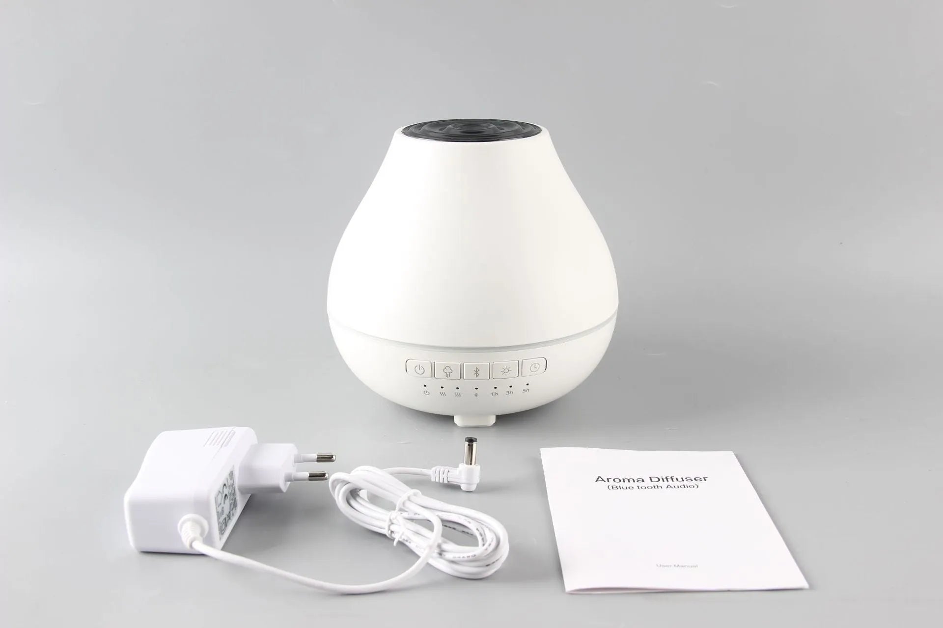 White round Bluetooth humidifier and essential oil aroma diffuser with night light.