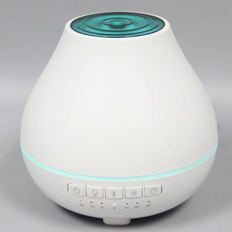White round Bluetooth humidifier and essential oil aroma diffuser with night light.
